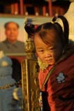 little girl in front of mao